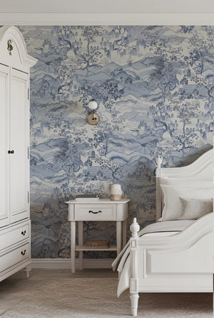 Dream Catcher wallpaper by Victoria Sanders in blue, a dreamlike toile of birds and foliage behind a bed