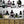Potions wallpaper by Dupenny in multicolour, shelves of potion bottles above a sideboard