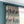 Red Coat velvet by Annika Reed in cream and teal, riders on horseback made into curtains