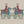Red Coat wallpaper by Annika Reed in teal and red, close-up of riders on horseback
