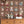 Resisting Arrest wallpaper by Brand McKenzie in brown, animal mugshot portraits above a cabinet