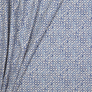 Riad linen by Bethie Tricks in blue, draped, showing a tile pattern