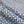 Riad linen by Bethie Tricks in blue, in soft folds showing a tile pattern