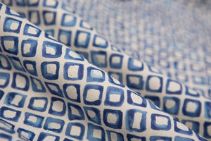 Riad linen by Bethie Tricks in blue, in soft folds showing a tile pattern