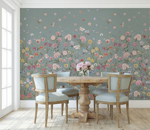 Seasons in Bloom wallpaper by Victoria Sanders in duck egg blue, a meadow of flowers rising from the base in a dining area