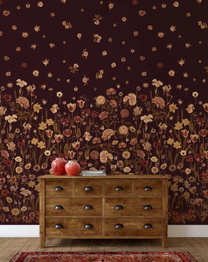 Seasons in Bloom wallpaper by Victoria Sanders in burgundy, a meadow of flowers rising from the base above a sideboard