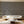 Seasons in Bloom wallpaper by Victoria Sanders in grey, a meadow of flowers rising from the base on a living room wall