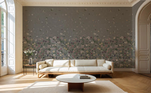 Seasons in Bloom wallpaper by Victoria Sanders in grey, a meadow of flowers rising from the base on a living room wall