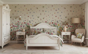 Seasons in Bloom wallpaper by Victoria Sanders in sage green, a meadow of flowers rising from the base in a bedroom