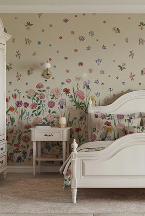 Seasons in Bloom wallpaper by Victoria Sanders in cream, a meadow of flowers rising from the base on a bedroom wall