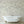 Seaview wallpaper by XV Interiors in cream, fish among seaweed on a bathroom wall