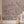 Seasons in Bloom wallpaper by Victoria Sanders in pink, a meadow of flowers rising from the base in a living room