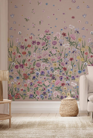 Seasons in Bloom wallpaper by Victoria Sanders in pink, a meadow of flowers rising from the base in a living room