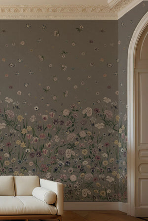 Seasons in Bloom wallpaper by Victoria Sanders in sage green, a meadow of flowers rising from the base in a living room