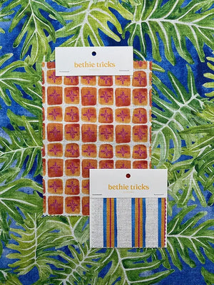 Sandy Stripes linen by Bethie Tricks in blue and orange, sample swatch set showing woven-look stripes