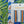 Sandy Stripes linen by Bethie Tricks in blue and orange, sample swatch cards showing woven-look stripes