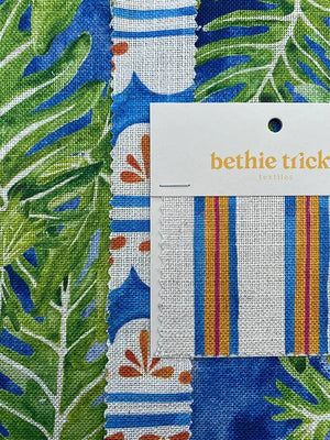 Sandy Stripes linen by Bethie Tricks in blue and orange, sample swatch cards showing woven-look stripes