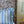 Double Scroll Stripe linen by Parker and Jules in blue, wavy scroll stripes on an upholstered chair