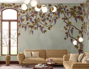 Seasons of the Vine wallpaper by Dami and Em Design in green, grape vines behind a sofa in a living room