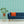 Gatty's Kelp Forest wallpaper by Annika Reed in mint green, kelp fronds in a living room