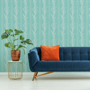 Gatty's Kelp Forest wallpaper by Annika Reed in mint green, kelp fronds in a living room