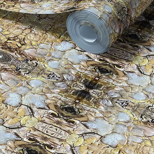 Shell wallpaper by Dami and Em Design in gold, roll showing shell motifs