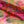 Siesta Key Eco velvet by Liberty James Studio in pink and green, draped, showing a marbled mirrored design