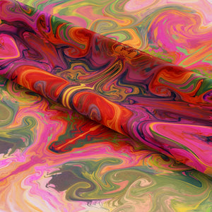 Siesta Key Eco velvet by Liberty James Studio in pink and green, draped, showing a marbled mirrored design