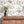 Sky Fair wallpaper by Brand McKenzie in white and pink, a pastel sky fair above a sideboard