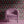 Soltar wallpaper by Tatie Lou in pink, a Deco arch pattern upholstered on an armchair