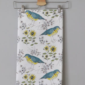 Song Thrush and Flora fabric by Seed Home Designs in blue and yellow, full repeat of song thrushes and flowers