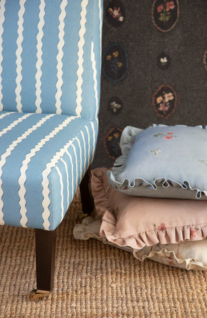 Double Scroll Stripe linen by Parker and Jules in blue, wavy scroll stripes upholstered on an armchair