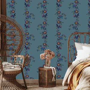 Passion Flower wallpaper by Tatie Lou in blue, trailing passion flowers on a living room wall