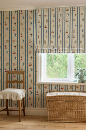Stow Away with the Sailors linen by Annika Reed in blue and red, sailors and boats in a living room