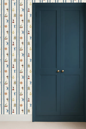Stow Away With the Sailors wallpaper by Annika Reed in blue and red, sailors and boats in a hallway