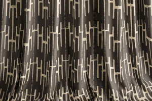 Structured Chaos velvet by Dami and Em Design in brown, a geometric design as lined curtains