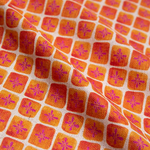 Sun Bloc linen by Bethie Tricks in orange and pink, draped, showing a painted grid