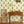 Sunflower wallpaper by Annika Reed in yellow and green, sunflowers above a sideboard
