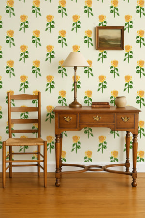 Sunflower wallpaper by Annika Reed in yellow and green, sunflowers above a sideboard