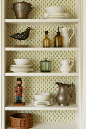Sunflower wallpaper by Annika Reed in yellow and green, sunflowers behind a console table