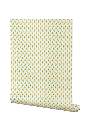 Sunflower wallpaper by Annika Reed in yellow and green, partly unrolled roll showing sunflowers