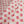 Sunrise linen by Bethie Tricks in pink, draped, showing small star motifs