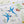 Forget Me Not wallpaper by Seed Home Designs in blue, flat sample of scattered forget-me-nots