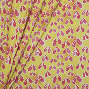 Sycamore linen by Bethie Tricks in yellow and pink, draped, showing sycamore seeds