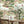 Tally Ho! wallpaper by Brand McKenzie in green, a countryside landscape in a dining room
