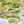 Tally Ho! wallpaper by Brand McKenzie in green and blue, close view of a countryside landscape