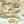 Tally Ho! wallpaper by Brand McKenzie in cream, close-up of a countryside landscape