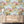 The Glitter Ranch wallpaper by Brand McKenzie in pink and blue, a desert ranch scene above a sideboard