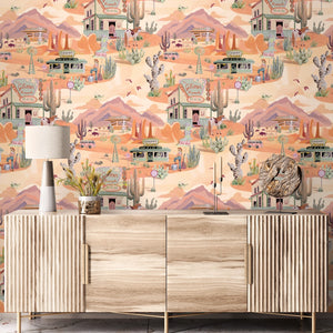 The Glitter Ranch wallpaper by Brand McKenzie in peach, pattern detail of a desert ranch scene