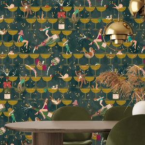 The Grand Pour wallpaper by Brand McKenzie in olive, swimmers among cocktail glasses behind a dining table